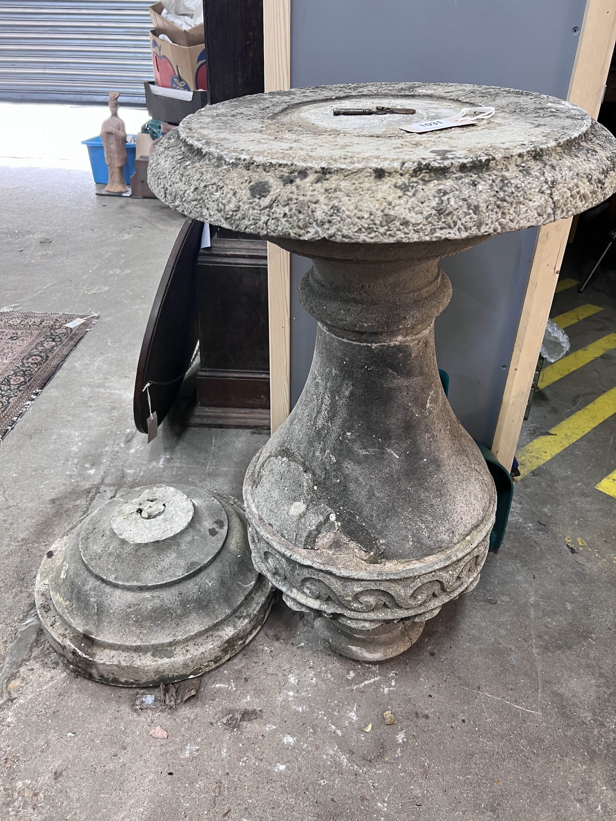 A reconstituted stone baluster sundial base, diameter 49cm, height 107cm (a.f.)